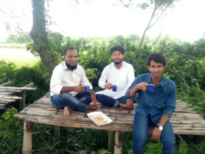  drinking tea at a stall inside the project during a project visit